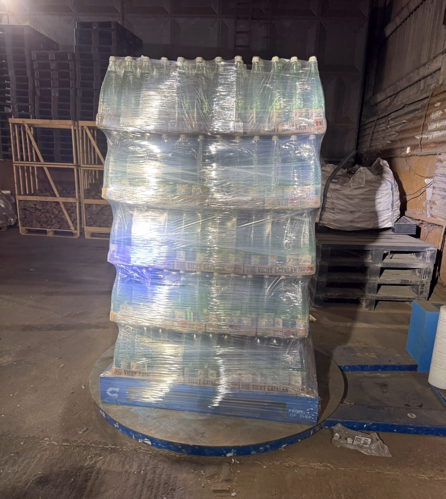 A repalletised load of bottled goods, freshly stretch-wrapped on the wrapping turntable